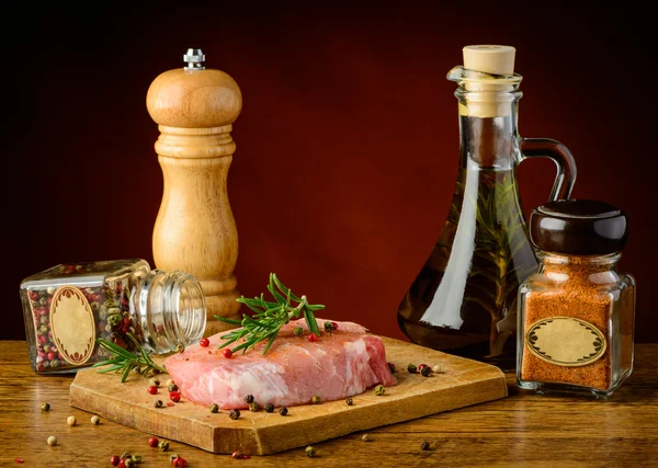 Raw steak and spices — Stock Photo, Image