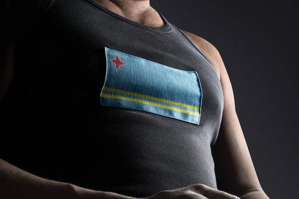 Національний прапор Аруби на грудях спортсменів. — стокове фото