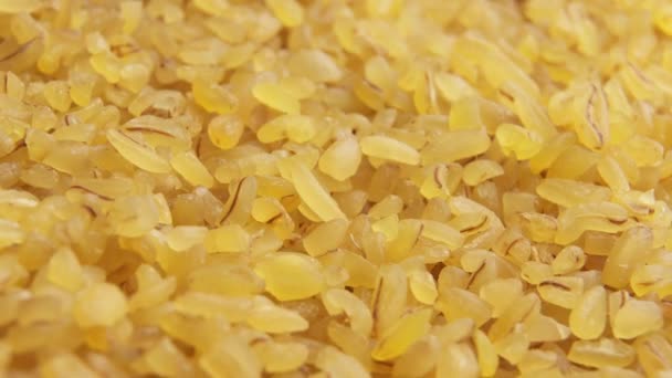 Bulgur grains close up slowly rotate — Stock Video