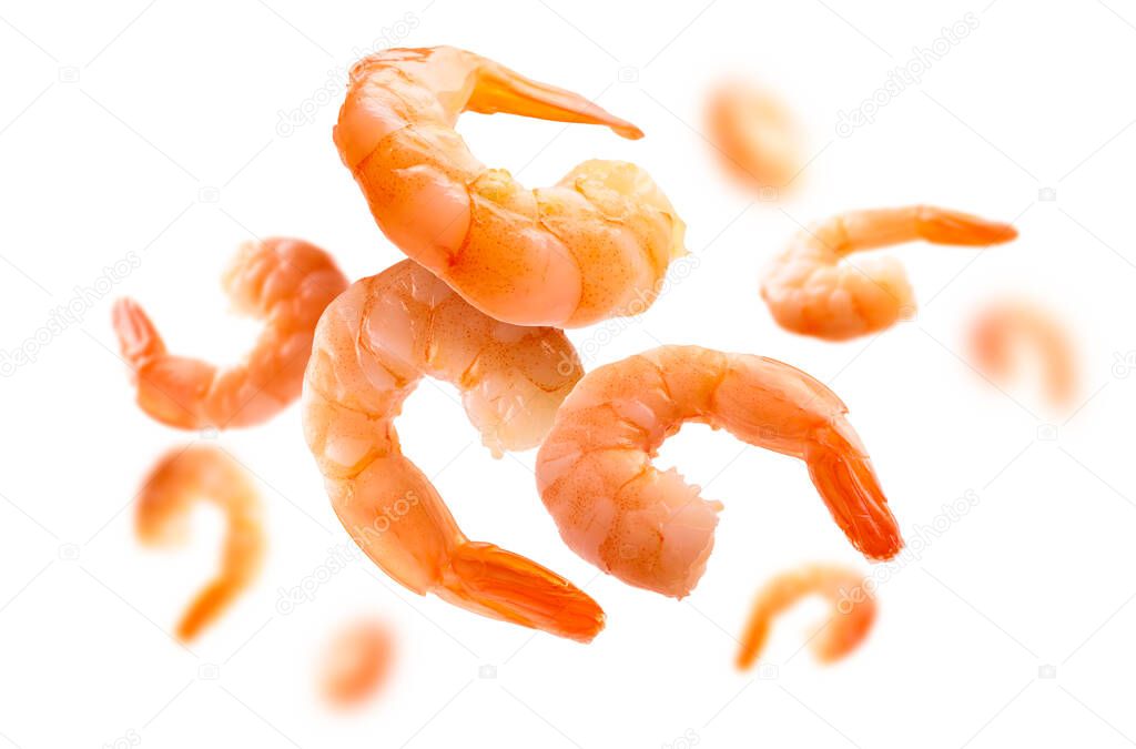 Boiled prawns levitate on a white background.