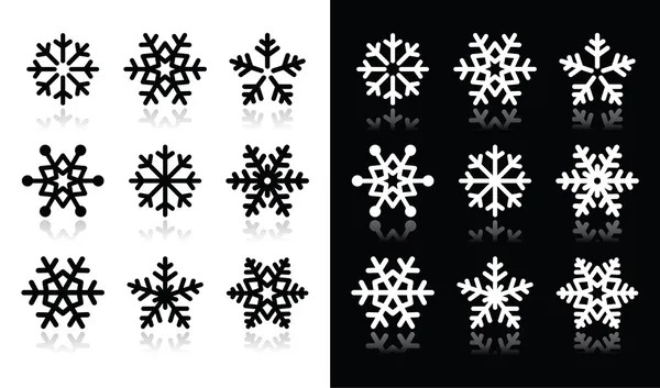 Copos de nieve iconos con sombra sobre fondo blanco y negro — Vector de stock