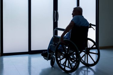 Patients sitting on wheelchairs have depression. Man patient in a wheelchair is discouraged