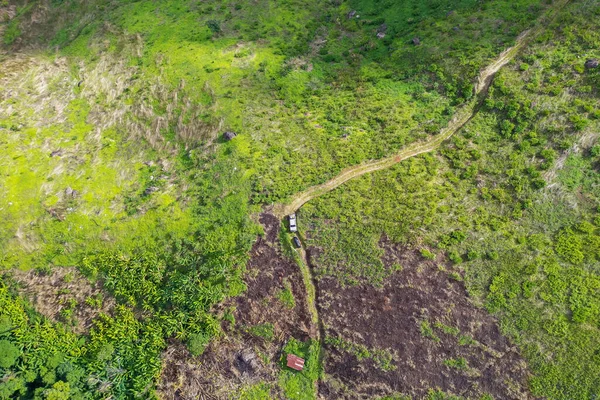 Aerial view of countryside road passing through mountain. Mountain pass road. Aerial view of a road on mountain