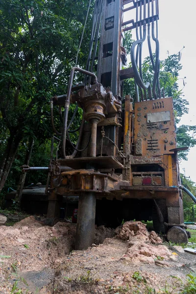 Ground water hole drilling machine installed on the old truck. Ground water drilling machine installed in rural