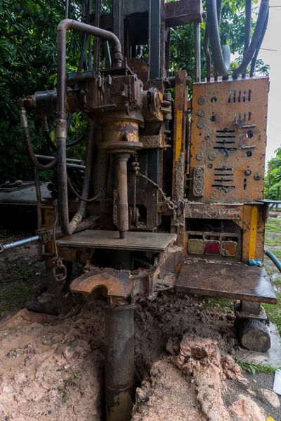 Ground water hole drilling machine installed on the old truck. Ground water drilling machine installed in rural