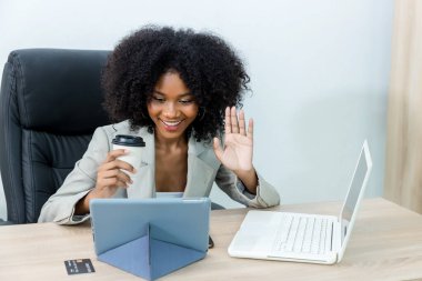 Woman making online call using Tablet or Computer notebook. businesswoman work at home and virtual video conference meeting with colleagues business people