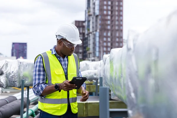 Industrial engineer work on site. engineer visit and inspection site engineer at industrial site. Inspector engineer check and working on site