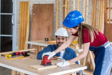 Carpenter working in carpentry shop. Carpenter working to making wood furniture in wood workshop
