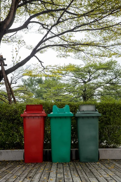Garbage bin in public park. colorful trash bin. wheelie bin for rubbish, Public trash background
