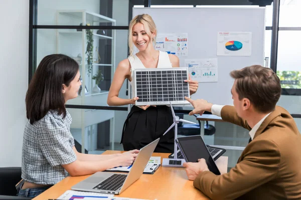 Business person meeting on solar cell panel technology. Business People Discussing Solar Power Environment Concept