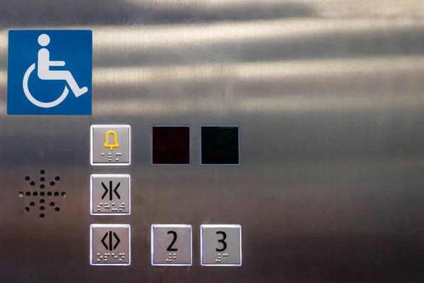 Image of disabled lift button. Stainless steel elevator panel push buttons for blind and disability people. Push Button For the disabled. Care and technology. Elevator buttons for disabled people.