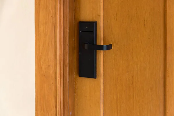 Smart card door key lock system in hotel. Hotel electronic lock on wooden door. Entrance door with electronic card lock security. Digital door lock security systems for access protection of hotel