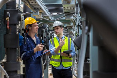 Industrial engineer work on site. engineer visit and inspection site engineer at industrial site. Inspector engineer check and working on site
