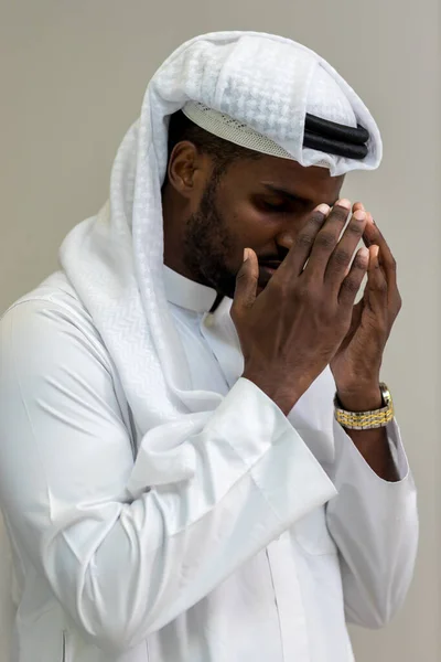 Muslim man having worship . Arab Muslim man praying in mosque stretching palms up. Moslem pray