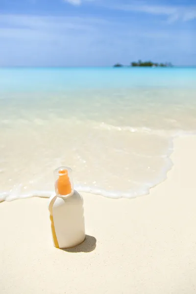 Havet, stranden, solkräm — Stockfoto