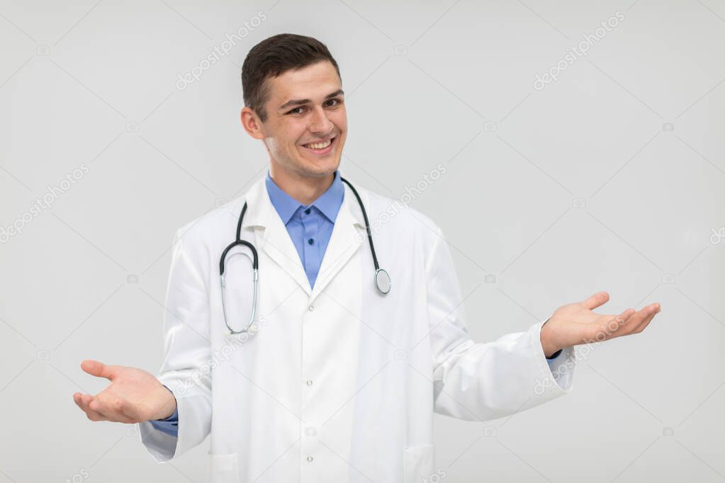 The smiling doctor spreads his arms from side to side and leaves the choice to the patient.