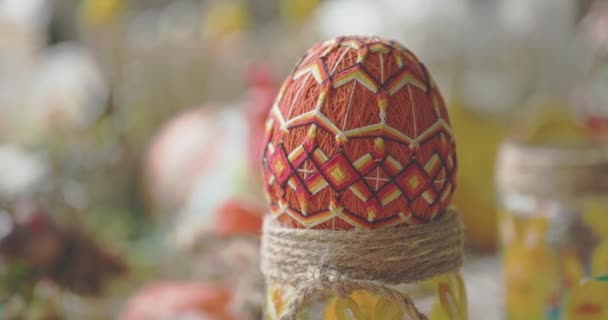 Large orange Easter egg with regular geometric pattern. — ストック動画