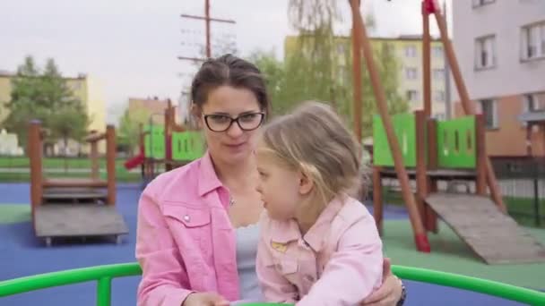 Caregiver Girl Spins Fast Carousel Cheerful Playground Children Dizzy Relaxing — Wideo stockowe