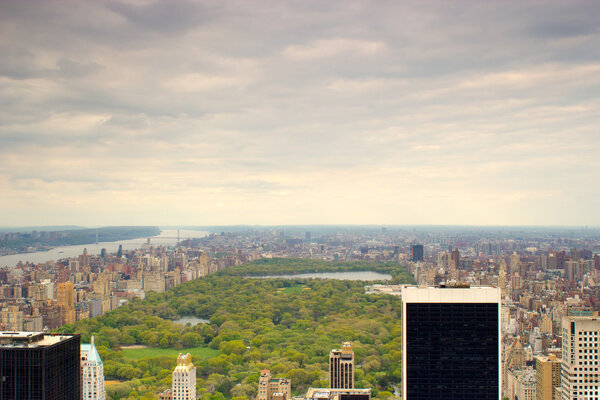 Horizontal view of the Hudson River and Central Park, Manhattan, New York on a cloudy day.