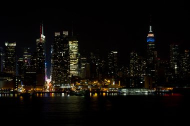 Midtown New York skyline at night clipart