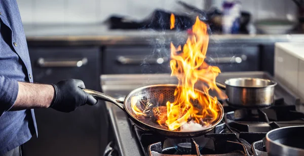 Chef Holding Pan Performing Flambe Dish — Stock Photo, Image