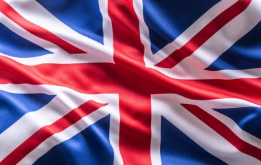 Büyük Britanya bayrağı sallıyor. Ülke ve devletin ulusal sembolü.