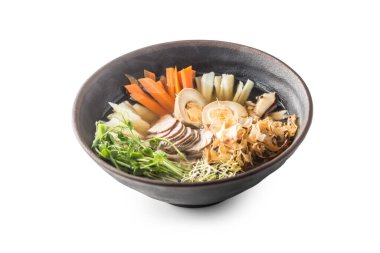 Traditional Japanese soup Ramen in bowl isolated on white.