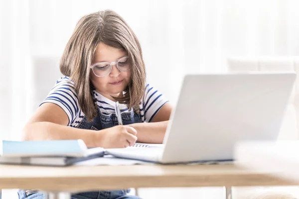 Girl Glasses Writes Notes Studing Distant Learning Internet — Stok fotoğraf