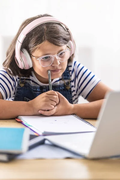 Hard Studying Girl Glasses Wears Headphones Chews Pencil Her Hand — стоковое фото