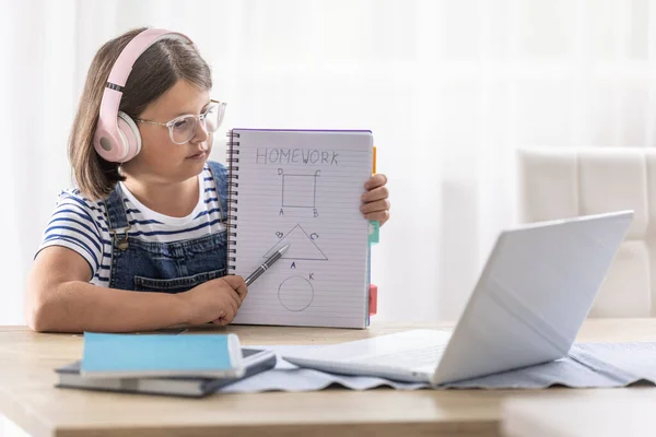 Schoolgirl Glasses Headphones Shows Her Homework Teacher Online Class Computer — стоковое фото