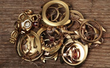 Old and broken jewelry, coins, watches of gold and gold-plated 