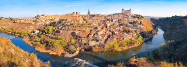 Panoramic view of the historic city of Toledo with river Tajo in Castile-La Mancha, Spain clipart