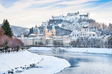 Salzburg skyline with Festung Hohensalzburg and river Salzach in winter, Salzburger Land, Austria clipart