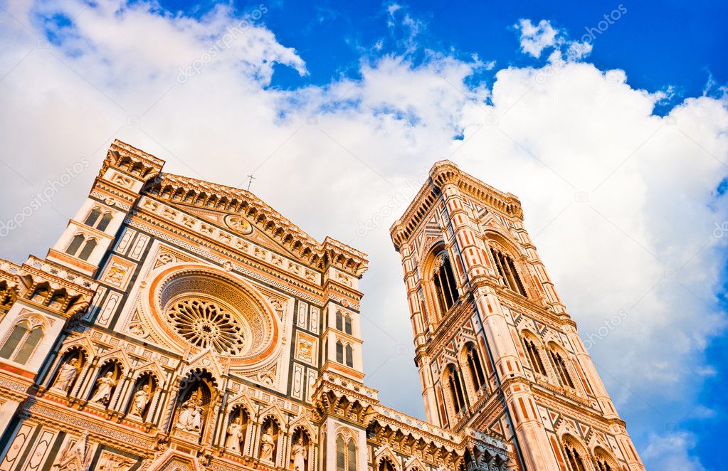 Florence Cathedral with Giotto's Campanile at sunset on Piazza del Duomo in Florence, Italy