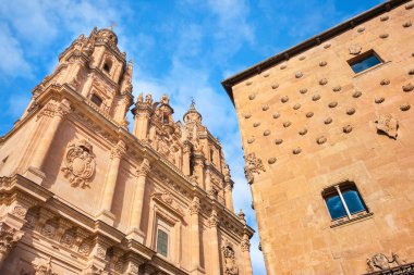 Famous Casa de las Conchas with La Clerecia Church in Salamanca, Castilla y Leon, Spain clipart