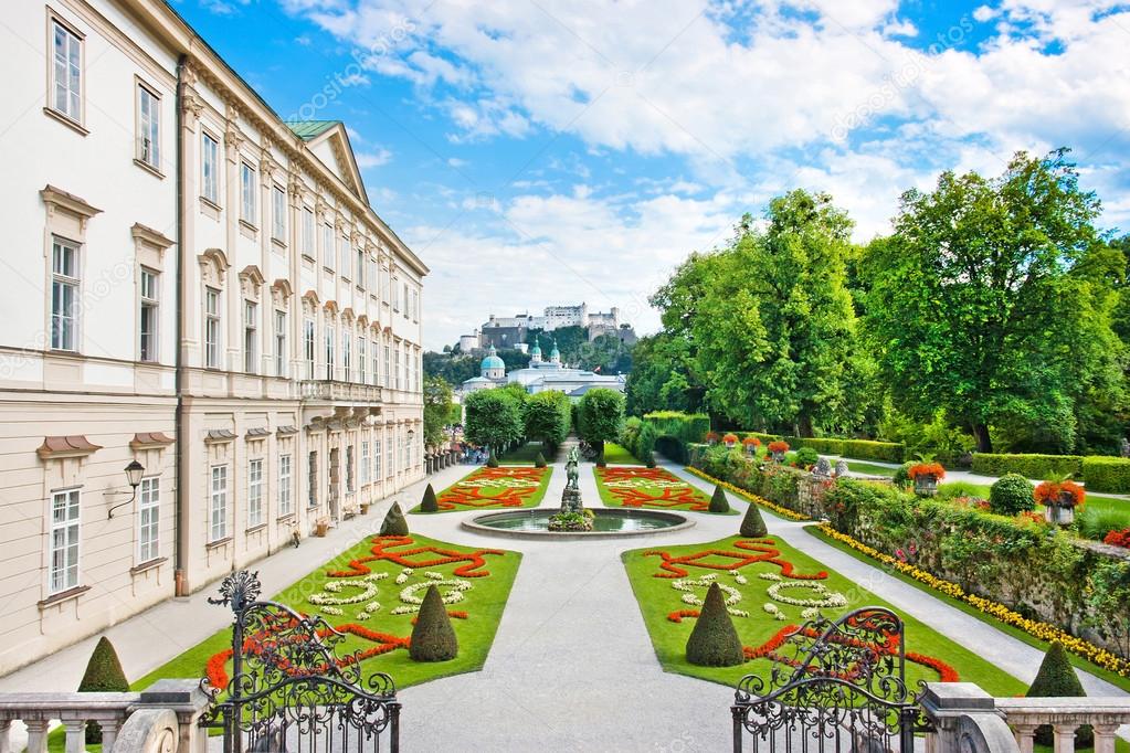 Mirabell Gardens with Mirabell Palace and the old historic Fortress Hohensalzburg in the background in Salzburg, Austria