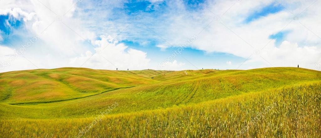 Panoramic view of rolling hills in Val d'Orcia, Tuscany, Italy