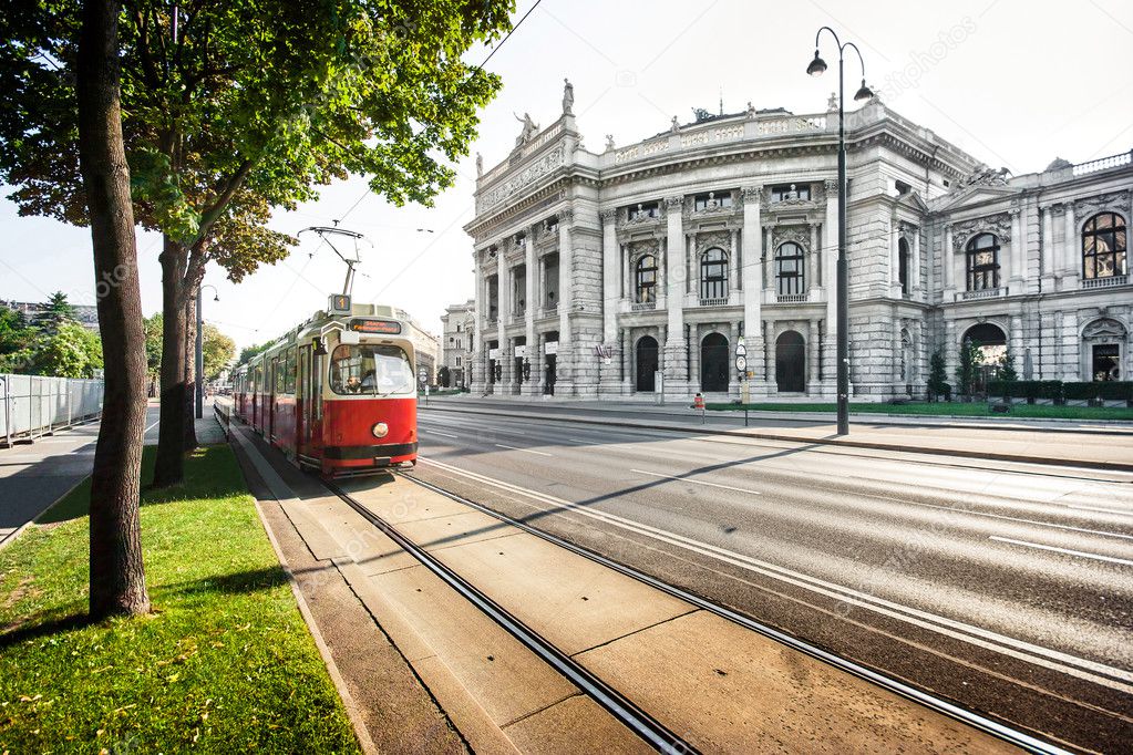 Famous Wiener Ringstrasse with Burgtheater and traditional tram in Vienna, Austria