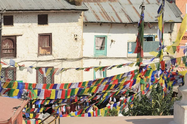 Buildings and prayer flags around the Boudhanath-Bodhnath stupa. Kathmand-Nepal. 0319 — Stock Photo, Image