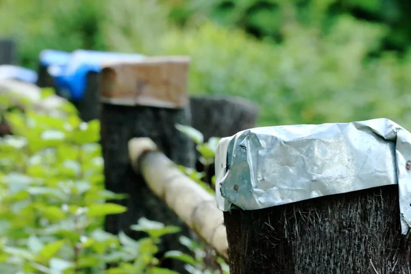 Fence with tin covered posts. Dhampus-Nepal. 0531 — Stock Photo, Image