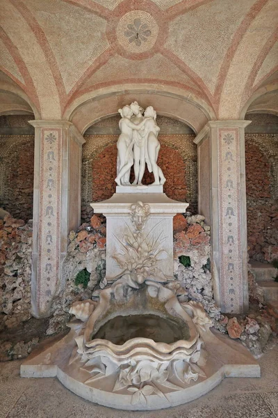 The Three Graces of Greek mythology-white marble statue anonymously carved-placed in the garden in 1909 -thus copyright expired- inspired by A.Canova\'s homonymous work. Estoi palace-Algarve-Portugal.