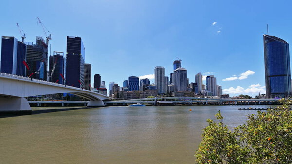 Northeastwards view across the river from the South Bank Parklands along the Victoria Bridge to the CBD-Central Business Distict with modern skyscrapers in the cityscape. Brisbane-Queensland-Australia
