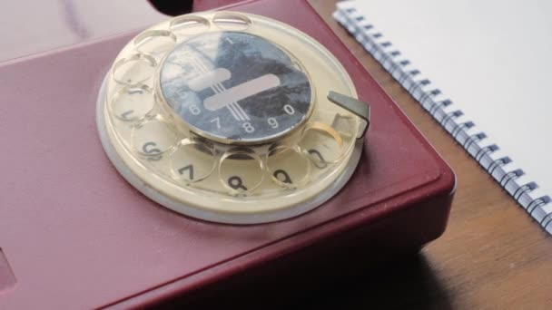 Top view, hand of a man dialing a number. old vintage landline phone — Stock Video