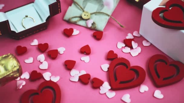 Pink and white hearts fall on a pink background. Love concept, Valentines Day, Mothers Day, March 8 — Stock Video