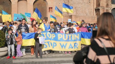 Italy, Rome, March 13, 2022. Photo with selective focus. Anti-war protest or rally against the invasion of Ukraine People are protesting against Russia attack on Ukraine. clipart