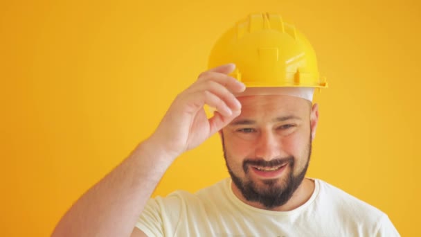 Construction Worker Hard Hat Yellow Background — Vídeos de Stock