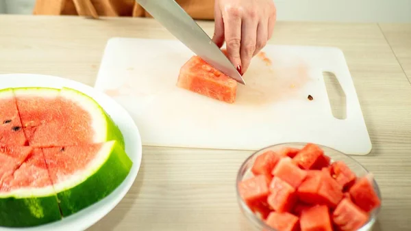 Woman Cuts Watermelon Cubes — Photo