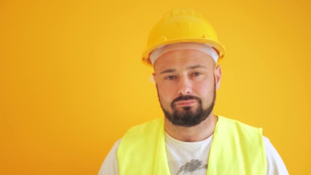 Construction Worker Hard Hat Yellow Background — Vídeo de Stock