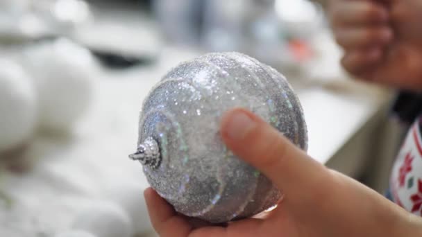 White Christmas Tree Ball Boy Touches Hook Ball — Vídeo de Stock