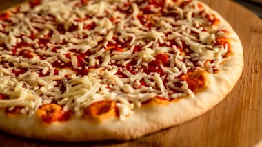 Pepperoni Pizza with Mozzarella cheese, salami, Tomatoes, pepper, Spices and Fresh Basil, Italian pizza
